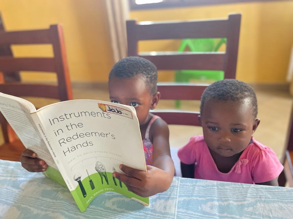 Babies reading at the table